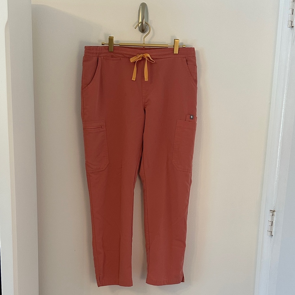 FIGS Women's Straight Leg Scrub Pants in coral with Yellow Drawstring